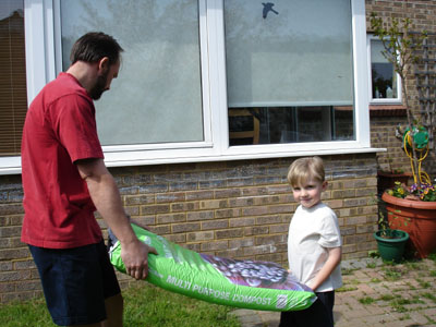 Josh helping Dad with the heavy garden work