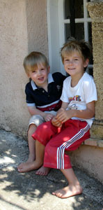 John and Joshua sitting on a window ledge