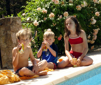 John, Joshua & Hannah enjoying some apple juice in the sun