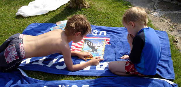 John showing Joshua his book on birds