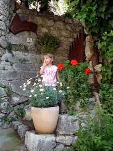 Misha poses in front of someone's front door in Peillon